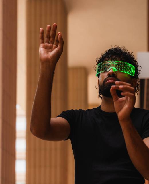 Latin software developer interacting with virtual reality using augmented reality glasses